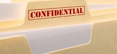 A close up of the tab from a confidential file folder.