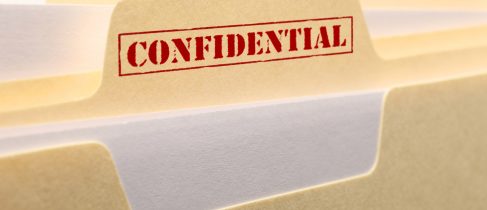 A close up of the tab from a confidential file folder.